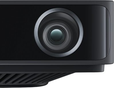 Videoproiettore Loewe We. BEAM nero, vista frontale ravvicinata dell'obiettivo centrale cerchiato d'argento