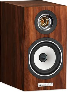Triangle Titus EZ Series teak wood bookshelf speaker in brown teak finish, three-quarter front view, rectangular cabinet with silver circular tweeter featuring a gold dome and white woofer with black trim