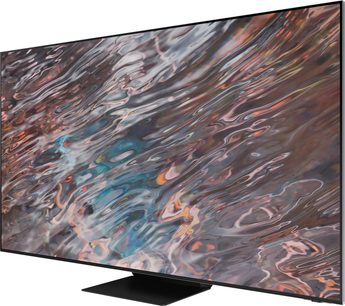 Samsung QE85QN800A TV set set forfra, der viser et abstrakt billede med levende og flydende farver, der minder om flammer