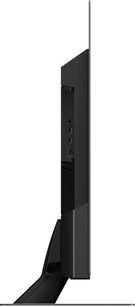 Televizor Panasonic TX-48MZ1500E, pohled z boku, plochá obrazovka, tenký černý rám, kovový stojan, porty HDMI a USB
