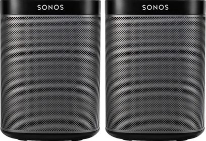 To trådløse, forbundne Sonos Play 1-højttalere i sort, set forfra, med metalgitre og cylindrisk form