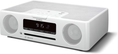 Bílý radiobudík Yamaha TSX-B235, pohled zepředu, s LCD displejem zobrazujícím čas, dvěma reproduktory a ovládacími tlačítky