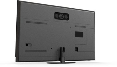 Panasonic TV-55Z95B højopløsnings-tv i mat sort plast, set bagfra i let højre vinkel, med centralt modul med tre justerede sensorer, dobbelte horisontale ventilationsgitre og rørformet fod fastgjort til en cirkulær base