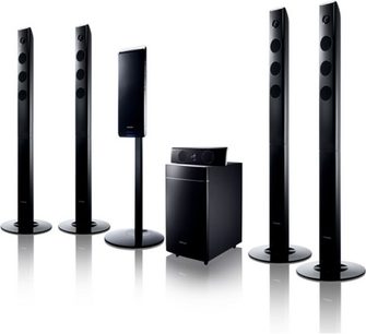 Samsung HT-TX500 home theater system consisting of 6 black tower speakers and a black subwoofer, viewed from the front