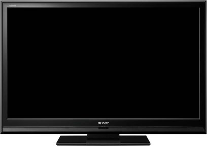 Sharp LC-46DH65E fladskærms-TV, stor rektangulær sort skærm, set forfra, smal ramme, Sharp-logo nederst i midten