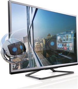 Philips 46PFL4528H fladskærms-TV, set lidt fra siden forfra, der viser en futuristisk by med oplyste skyskrabere