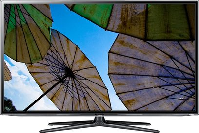 Plochý televizor Samsung UE40ES6100W zobrazující obrázek barevných slunečníků focených zespodu