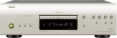 Denon DBP-4010 sølvfarvet 4K Blu-ray-afspiller, set forfra, med digitalt display i midten, knapper og stik på forsiden