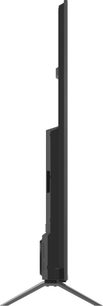 Panasonic TV-85W95BEG fjernsyn i sort plast og metal, ultratynd profil med tykkere bagpanel i nederste del og V-formede ben, set fra siden