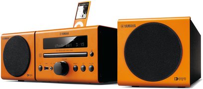 Yamaha MCR-040 orange mini hi-fi system with CD player, USB port, LCD display, buttons, and two black speakers, front view