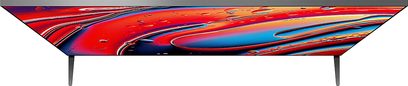 Sony BRAVIA 9 TV (85XR90) set forfra, fladskærm med tynd ramme, understøttet af 2 fødder, farverigt abstrakt display