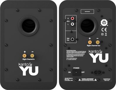 Rückansicht eines Sets aus zwei schwarzen Kanto YU WLAN-Lautsprechern, mattschwarzes Holzgehäuse, runde Bassreflexöffnung, weißes Logo und vergoldete Anschlussterminals, die rechte Box zusätzlich mit RCA-Eingängen, Subwoofer-Ausgang, Schalter und Netzanschluss