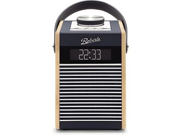 Roberts Rambler Midi table radio in light wood and plastic, navy blue, front view, with dark leather arched handle, large metal knob on white top panel, digital display showing 22:33, and contrasting horizontal grille