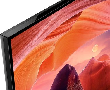 TV KD50X80L øverste venstre hjørne, sort ramme, skærm viser orange klippelandskab med synlig måne