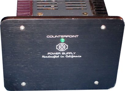 Counterpoint Power Supply SA-5000 strømforsyning, sort kabinet, frontpanel med grønt logo, knapper og stik på bagsiden