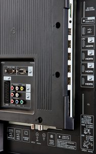 Rear panel of a Sharp LC-80LE645E television with HDMI, USB, VGA, component, audio, and coaxial antenna connectors