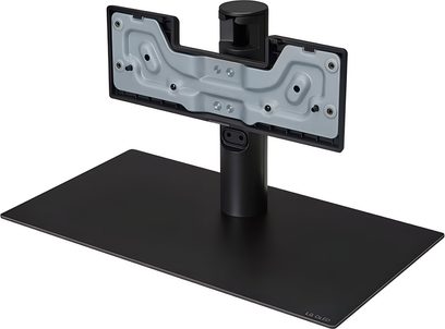 LG TV-stativ ST-G4SN55 i sort og grå, lavet af metal, består af en flad, rektangulær base, en central cylindrisk stang og en frontmonteret monteringsplade, set i trekvart forfra