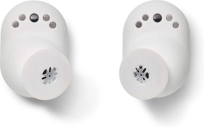 Bezdrátové sluchátko DEVIALET Gemini II iconic bílé, dva pohledy zepředu, perforované mřížky, boční tlačítka, matný bílý povrch