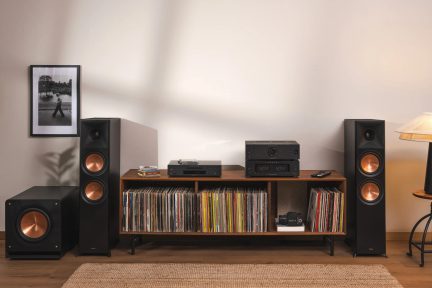 Black Klipsch hi-fi system with floorstanding speakers, subwoofer and copper-colored drivers