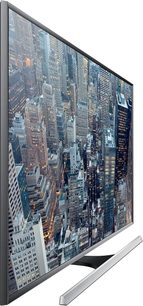 Samsung UE85JU7000 fladskærms-TV med luftfoto af skyskrabere i en storby