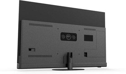 Panasonic TV-55Z90B high-definition television in matte black plastic, rear view at a slight angle, featuring a textured back panel with ventilation grilles, central module with three lenses, and a cylindrical stand on a circular base