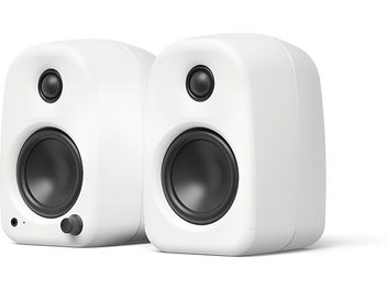 Pair of Kanto UKI matte white speakers, rounded design with black drivers shown from the front