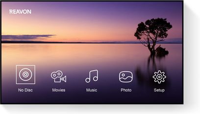 Startskærm på en Reavon UBR-X200 Blu-ray-afspiller, der viser 5 ikoner på en baggrund af en lyserød solnedgang over en sø med et træ