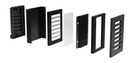 Seven black rectangular pieces and one white aligned, including grids, frames, and solid plates