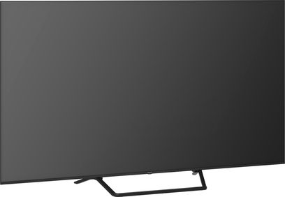 Panasonic TV-75W95BEG sort højopløsnings-tv i sort, fladskærm i glas med tynd plastikramme placeret på et rørformet metalstativ, set fra venstre forfra i trekvarts profil