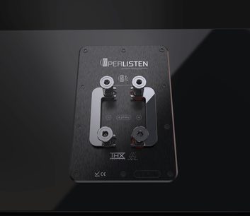 S7c center speaker with a rectangular black rear panel, 4 metallic connection terminals, visible technical inscriptions, and logos.