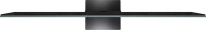 Televisor TCL 85C9K negro, marco metálico ultrafino con rejilla de ventilación continua a lo largo de todo el ancho y base central rectangular de metal cepillado, vista superior