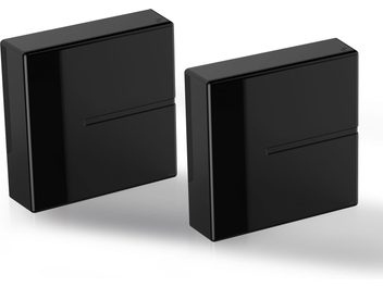 Two glossy black rectangular enclosures of different sizes, standing vertically, with a slot on the front face
