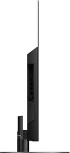 Téléviseur Panasonic TX-55HZ1000E, vue de profil, écran plat, cadre et pied noirs, connectique sur le côté droit