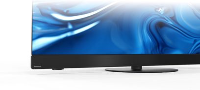 Panasonic TV-55Z90B high-definition television in black, with metal and plastic finishes, partial front view showing the slim lower bezel, integrated soundbar, and circular metal stand
