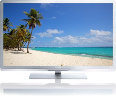 Hvid sandstrand med palmer og turkisblåt caribisk vand på en solrig dag, vist på en Philips 42PFL6805H TV-skærm