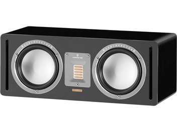 AudioVector QR Center SE black center speaker, rectangular black cabinet with lacquered finish, three-quarter front left view, two silver metal-cone drivers with aluminum rings, central ribbon tweeter on aluminum plate, vertical bass-reflex slots at the ends