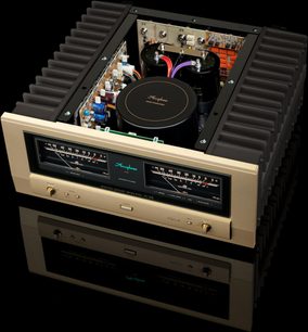 Интегриран стерео усилвател Accuphase A-48S, изглед отгоре, правоъгълен корпус, златна предна част, два големи VU метъра, кръгли бутони, черни охладителни ребра, видими вътрешни компоненти