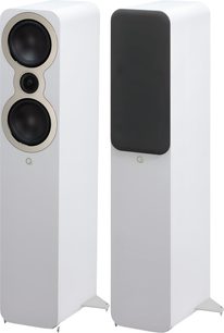Two Q Acoustics 3050c white floorstanding speakers, lacquered wood cabinet with rounded edges, shown in three-quarter front view—one with two bass drivers and a metal-ringed tweeter, the other with a black acoustic grille, both on metal plinths with spikes