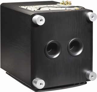 Mirage Omni S10 cubic black subwoofer, 3/4 front view, with 2 round speakers on the front face and a bass reflex port on top