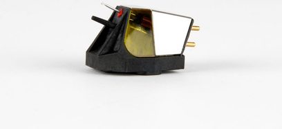 Rega Nd7 turntable cartridge, side view, black casing, gold elements, two metal pins, visible tip