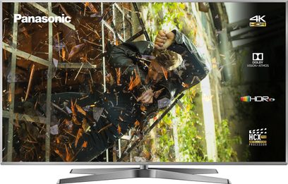 Panasonic TX-75GX942E 4K HDR-fladskærm, der viser en junglesscene med grønt løvværk og sammenfiltrede grene