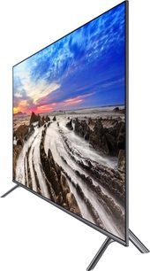 Samsung UE65MU7045 fladskærms-TV, set forfra, der viser et snedækket bjerglandskab ved solnedgang