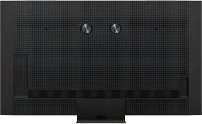 TCL 85C8K högupplöst TV i matt svart plast med rutmönster, bakifrån med två centrala metallskivor och en rektangulär bas undertill
