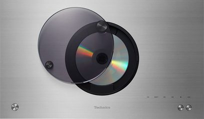 Technics SC-C70MK2EGS højttalersystem i metallisk grå, set forfra, to cirkulære højttalere med iriserende refleksioner