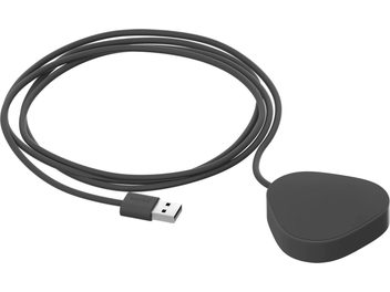 Black power cable and circular black wireless charger for Sonos Roam, top view on white background