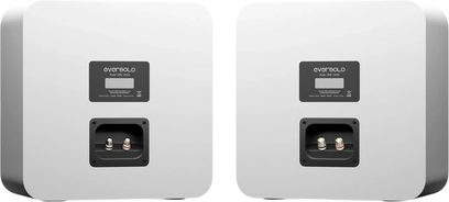 Pair of white EverSolo SE-100 speakers viewed from the rear, with recessed terminals and rounded corners