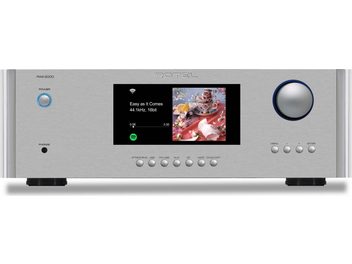 Integrirani stereo hi-fi ojačevalnik Rotel RAS-5000, pogled od spredaj, srebrno ohišje, osrednji zaslon, okrogel gumb za glasnost na desni