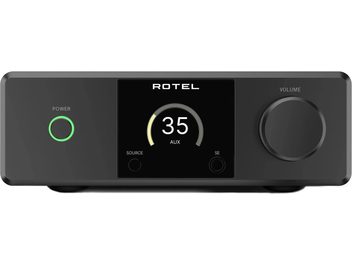 Vista frontal do amplificador hi-fi integrado estéreo Rotel DX-5 preto, gabinete metálico fosco, botão de energia circular retroiluminado em verde à esquerda, display central preto com indicador e visor digital, grande botão de volume à direita