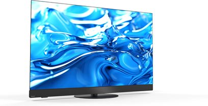 Panasonic TV-55Z90B high-definition television in black with an ultra-slim metal frame and central circular stand, edge-to-edge screen displaying blue waves, three-quarter front left view