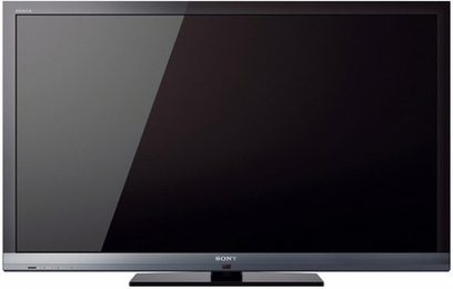 Sony KDL-46EX710 sort fladskærms-TV set forfra med slukket sort skærm på mørk grå og sort baggrund